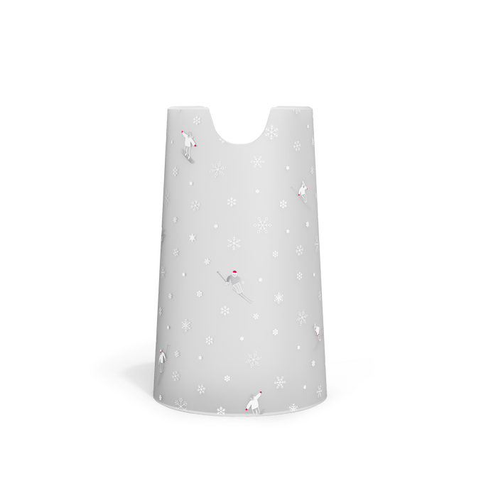 Front view of white, frosted holiday-themed sleeve for Simplehuman 10 oz. Sensor Pump Foam, featuring small skiers and snowflakes.