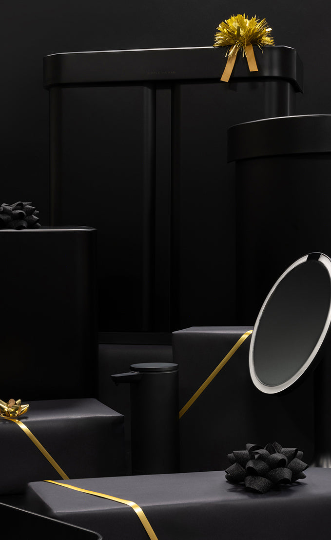 Simplehuman Black Friday 2025 with black gift boxes with gold and black ribbons on a black background.