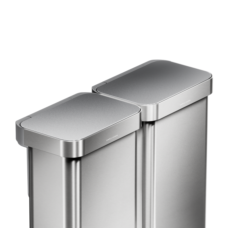 Simplehuman's 90L Step Recycler in Brushed. This image is highlighting the can's lid that is made our of stainless steel.