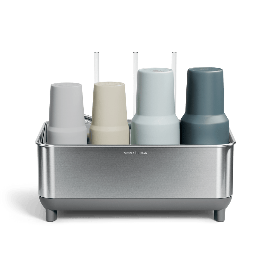 Front view of Simplehuman Brushed stainless steel Bottle Dock holding four reusable bottles in assorted colors.