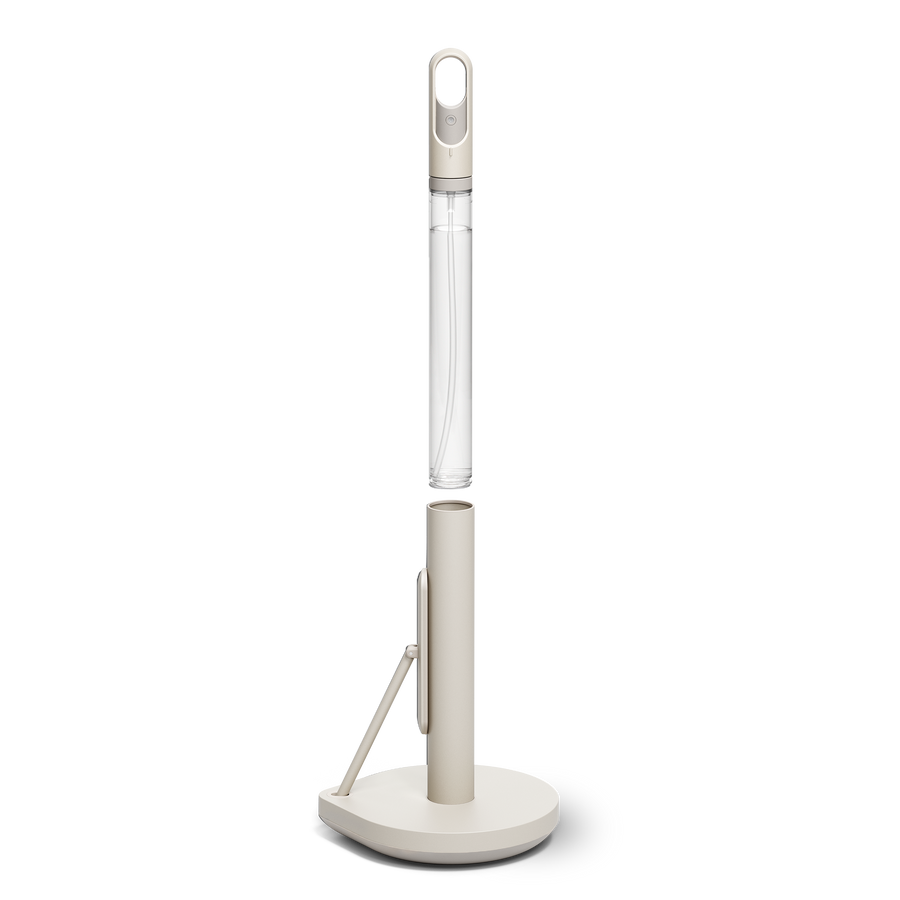 Simplehuman's Paper Towel Holder with Spray showcasing the pump being take out of the holder. 