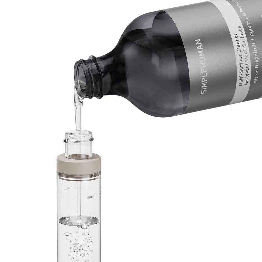 Simplehuman's Paper Towel Holder with Spray filling the pump with Multi-Surface Cleaner. 