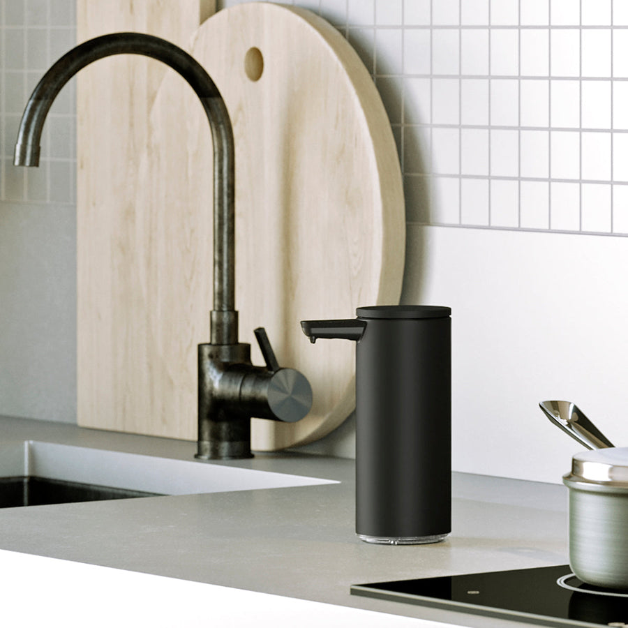Simplehuman Matte Black 9 oz. Rechargeable Sensor Pump on a modern kitchen counter, touch-free and drip-free.