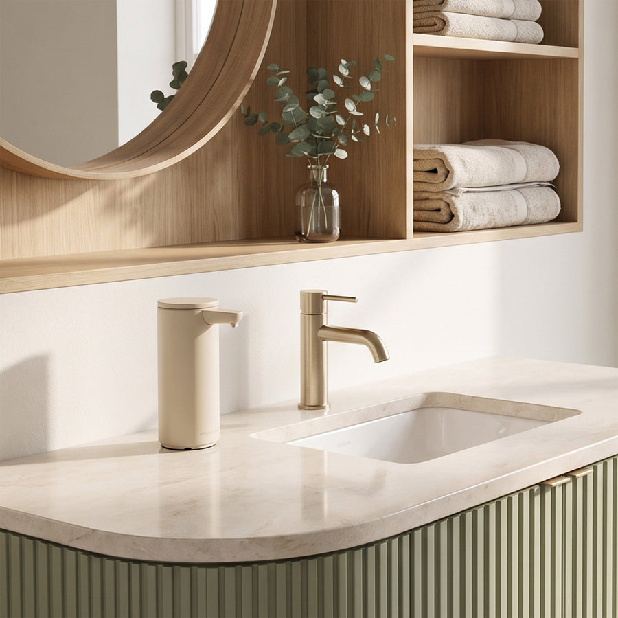 Simplehuman's Latte 9 oz. Sensor Pump in a modern kitchen setting on a marble countertop. 