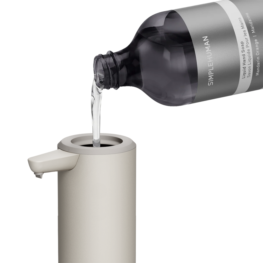 Simplehuman's 9 oz. Liquid Sensor Pump with Liquid Hand Soap pouring into the bottle. 