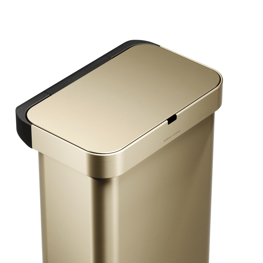 Simplehuman's Sensor Can in Matte Gold showcasing the lid and the sensor on the top of the can. 