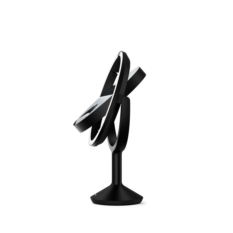 Simplehuman's Sensor Mirror Trio Max in Matte Black. Image of mirror flipping automatically from a side view.