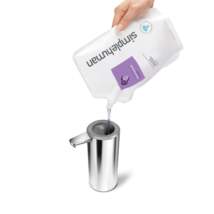 Refilling Simplehuman 9 oz. Sensor Pump in Polished Stainless Steel using soap pouch, wide funnel for easy refill.