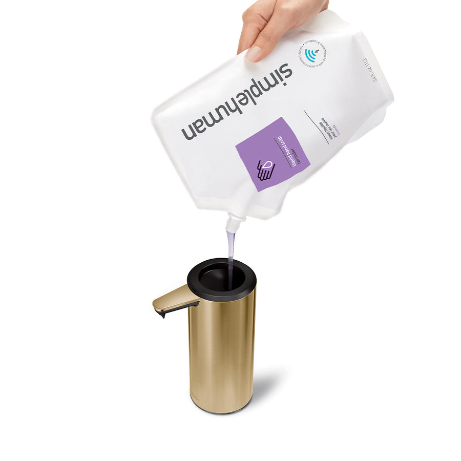 Refill view of Simplehuman 9 oz. Sensor Pump in Brushed Brass using a soap pouch, wide opening for easy use.