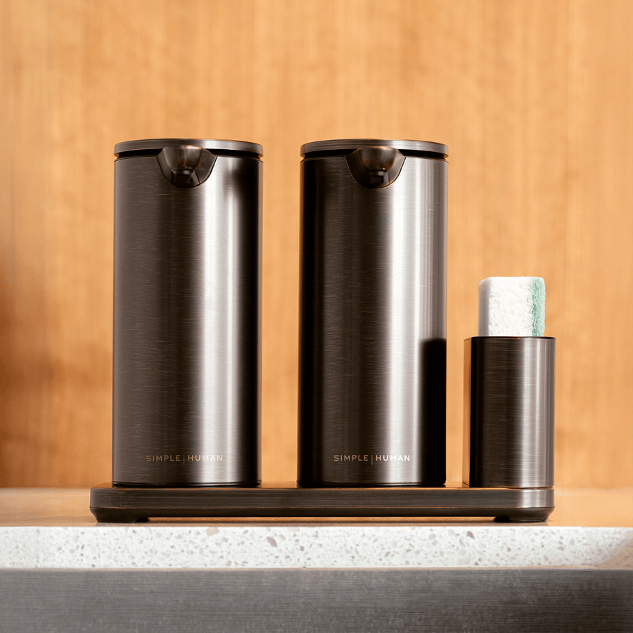 Straight front view of Simplehuman Dual Sensor Pump 14 oz + Caddy in Dark Bronze finish, touch-free organized sink storage.