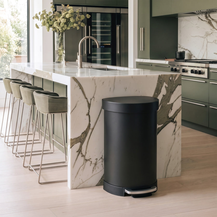 Simplehuman's 45L Semi-Round Step Can in Matte Black in a modern kitchen setting. 