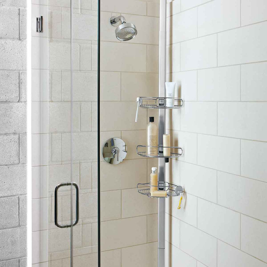 Simplehuman Stainless Steel 9 Ft. Tension Shower Caddy, full view showing adjustable shelves for bottles and accessories.