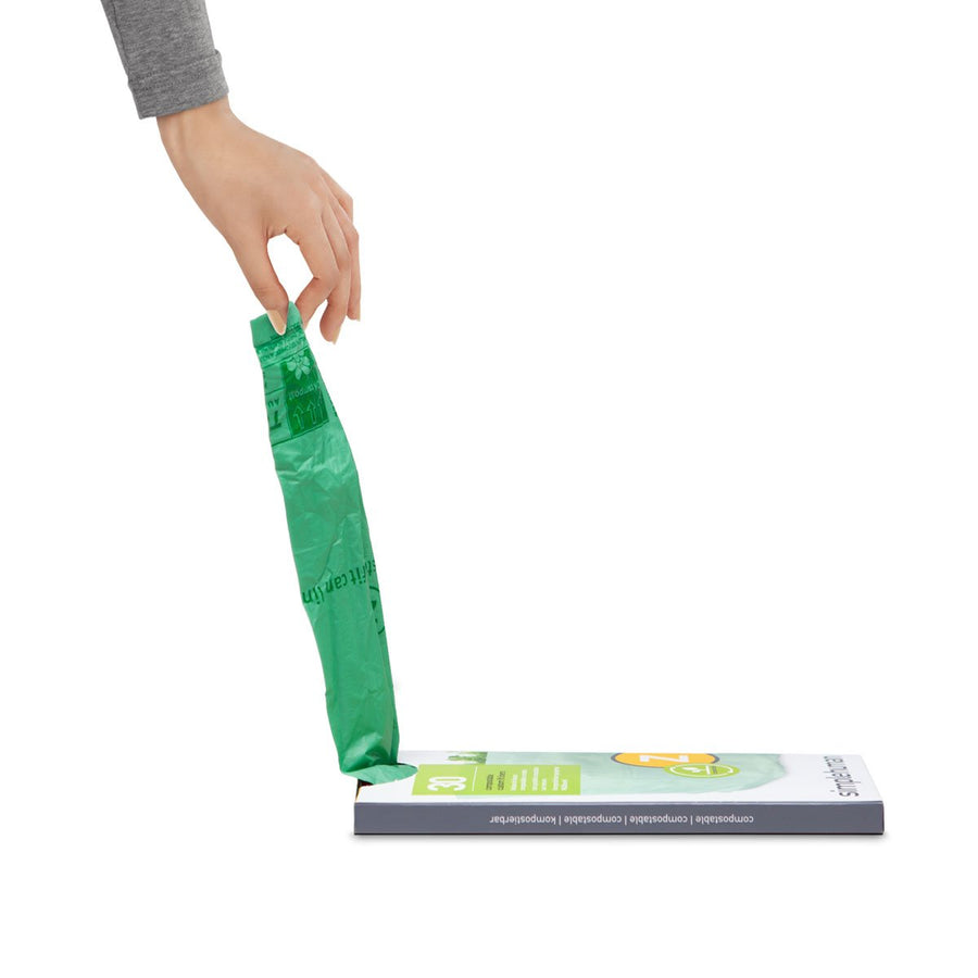 Detail view of Simplehuman Code Z Compostable Liner being pulled from the custom fit dispenser box.