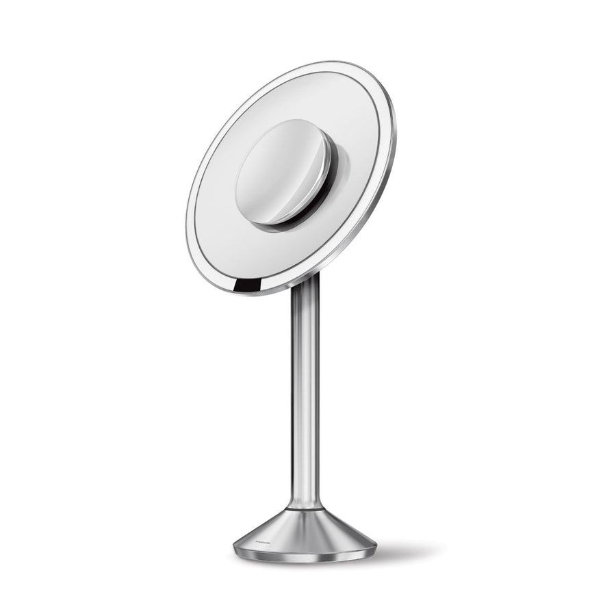 Angled view of Simplehuman Sensor Mirror Pro Round, Brushed Stainless Steel, hands-free sensor.