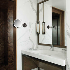 hard-wired wall mount sensor mirror - dark bronze finish - lifestyle in bathroom image