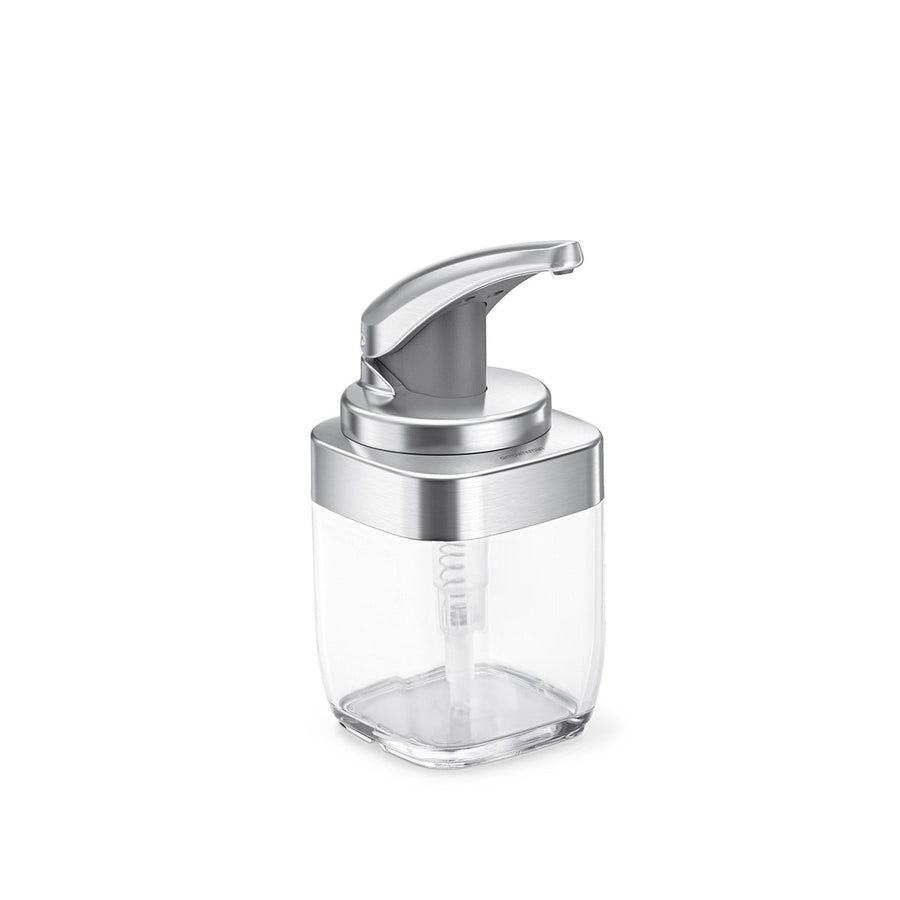 Angled view: Simplehuman Square Push Pump soap dispenser, Brushed Nickel finish, clear easy-view reservoir.