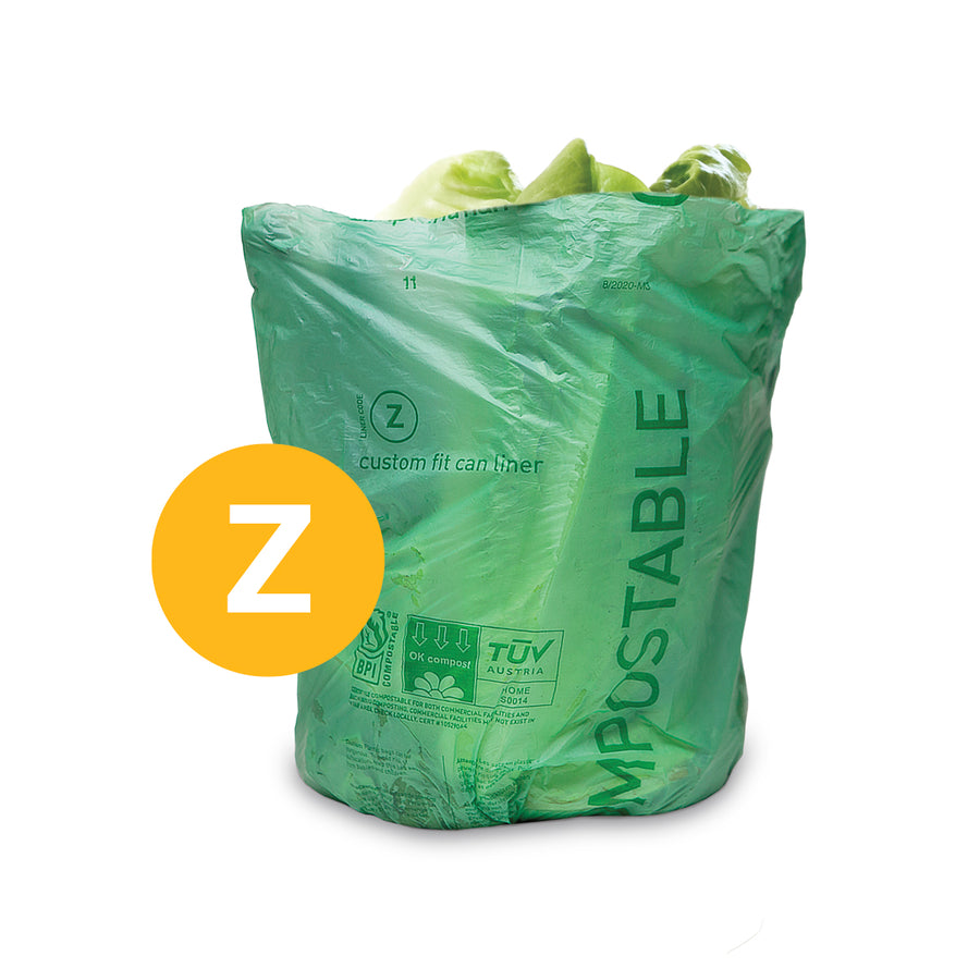 Simplehuman Code Z Compostable Custom Fit Liner, light green material shown in use with food waste, BPI certified.